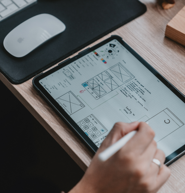 Person sketching out a design on a tablet computer